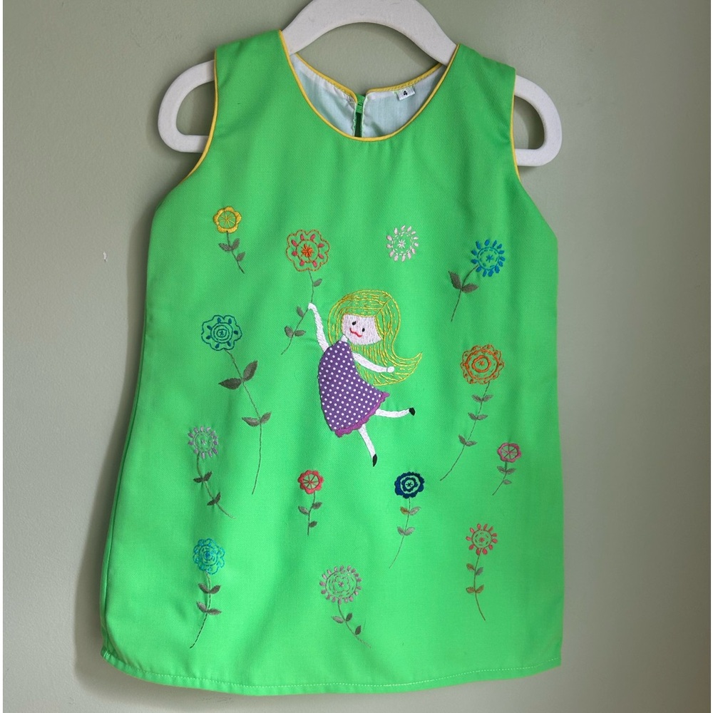 Vintage sleeveless  A line dress in lime green. Embroidered girl w/flowers. Sz 4